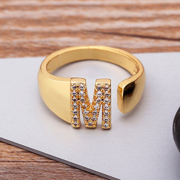 Wide gold adjustable ring with a selectable letter