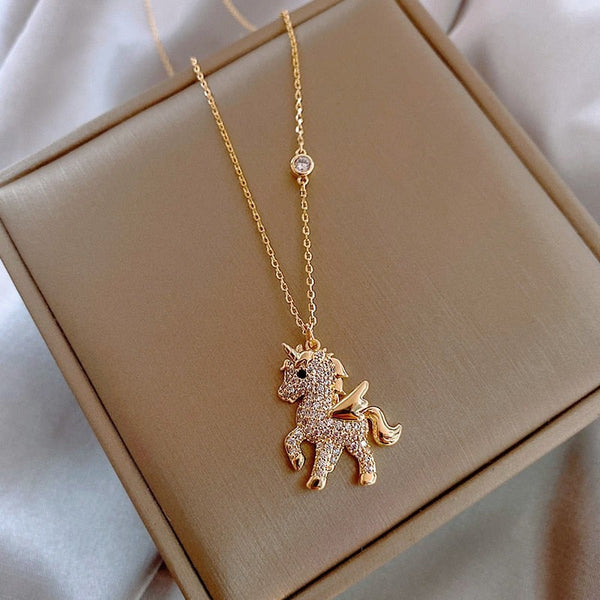 Golden necklace with unicorn pendant