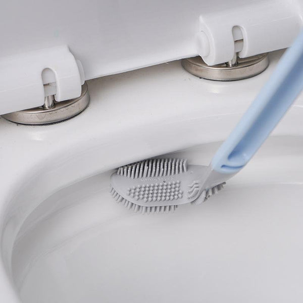 Silicone toilet cleaning brush shaped for corners
