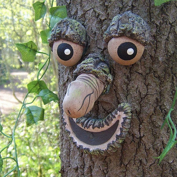 Funny garden decoration tree face old man